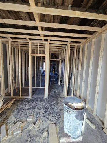 Wooden framework for interior walls in a house under construction.