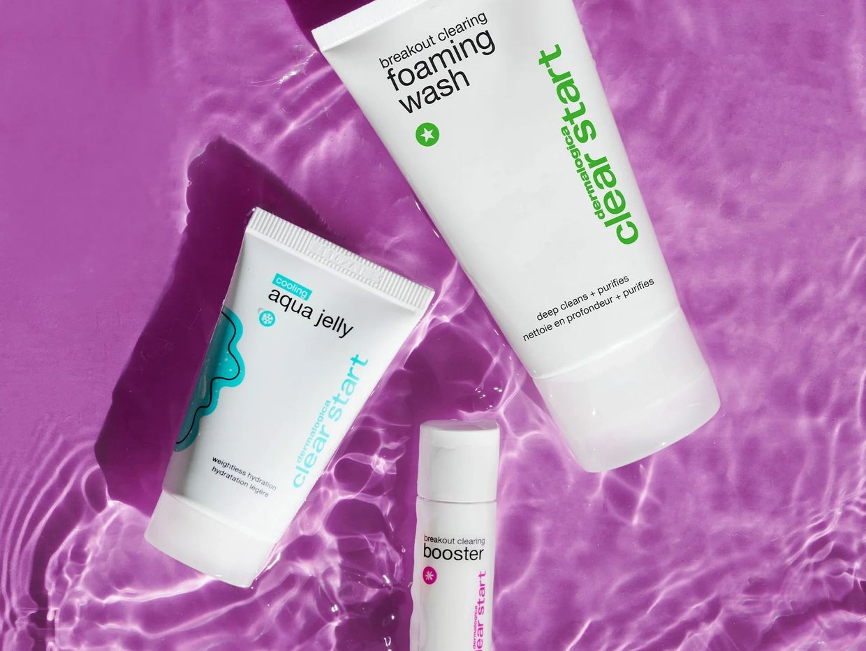 Dermalogica Clear Start skincare products on purple surface.