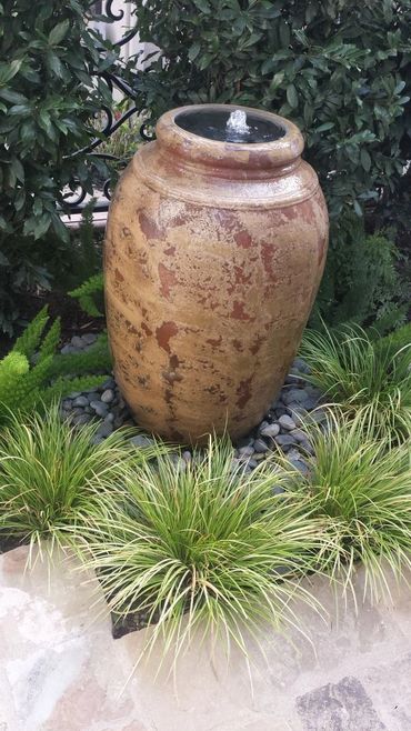 Rustic vase fountain adds visual interest