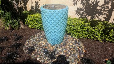 Stylish vase fountain adds interest to landscaping