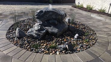 Water feature and fire pit create a backyard for entertaining