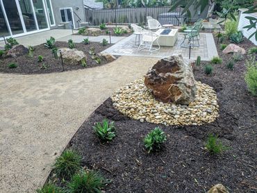 Natural boulder water feature in complete backyard remodel Orange County