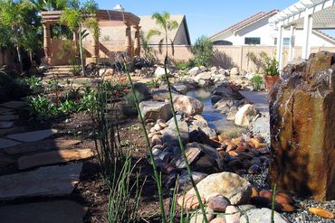 Custom water features, masonry and landscaping in backyard remodel Orange County