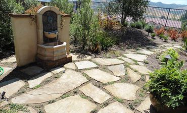 California Mission-style fountain and drought tolerant yard with native plants