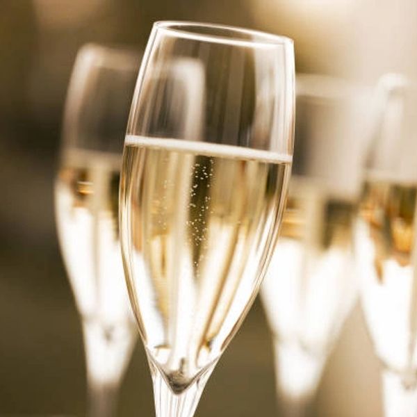 Close-up of champagne glasses with bubbles.