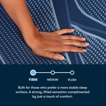 Hand on firm mattress surface with comfort levels.