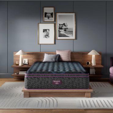 Modern bedroom with Beautrest mattress and framed black-and-white photos.