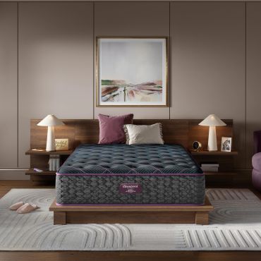Modern bedroom with Beautyrest mattress and wooden furniture.