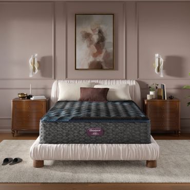 Elegant bedroom with a plush bed and modern decor.