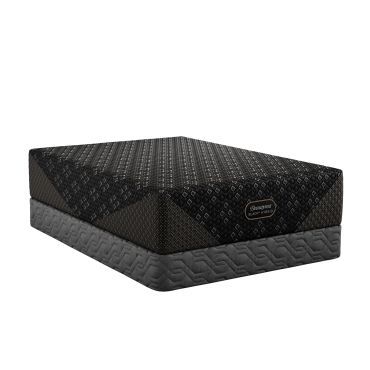 Luxury black hybrid mattress on a grey base.