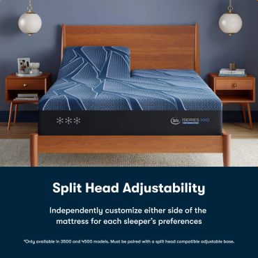 A split head adjustable mattress in a wooden bed frame.