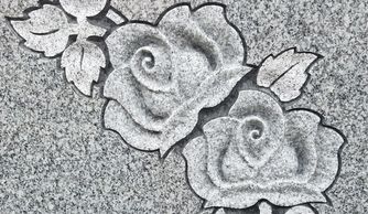 Custom deep carved roses on a barre gray upright memorial