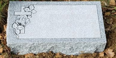 Gray bevel marker with a custom deep carved rose and cross design