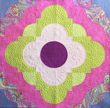 Drunkards Path quilt made by free motion and traditional quilting teacher Joy Clark