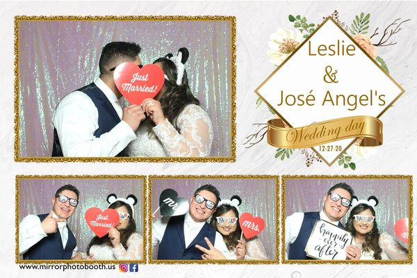 bride and goom using props and signs taking selfies wedding day