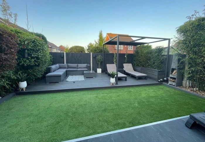 Composite decking and artificial lawn garden design by D&M Landscapes Bacup in Rossendale .