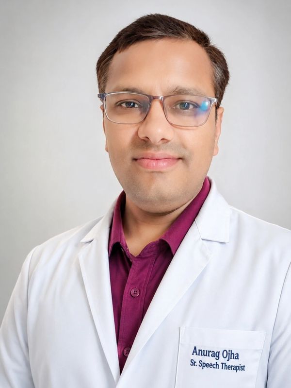 Professional portrait of Sr. Speech Therapist Anurag Ojha in a white coat.