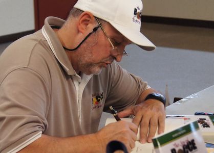 Author of "Joy of Bocce" giving an autograph