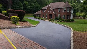 a driveway sealcoated with neatness