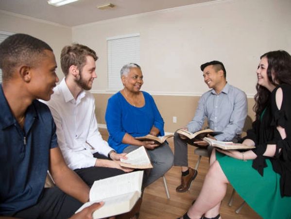 Christian people reading the bible in a group session