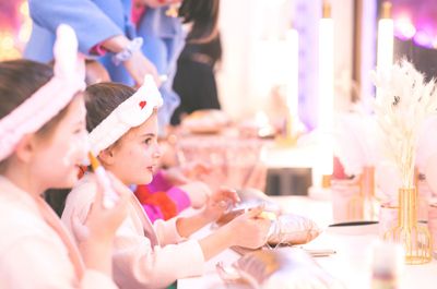 kids enjoying a spa-themed pamper session with headbands fun skincare and creative activities