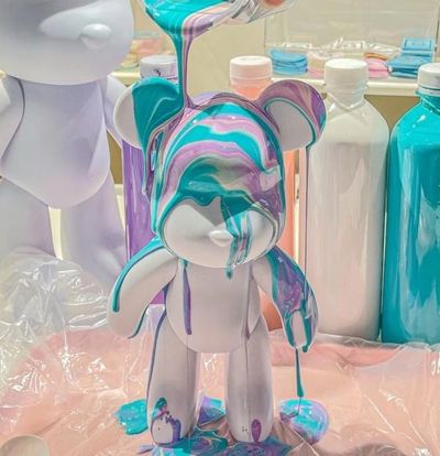 vibrant brick bear painted with colorful pouring art perfect creative kids parties art experiences