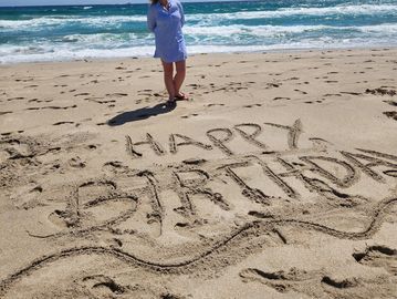 Juno Beach cabana rental with beach chairs and umbrellas. Birthday Beach Day!