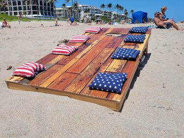 Beach cabana rental with umbrellas and a game package for a beach party.