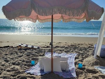 Luxury beach cabana and chair setup for rent in West Palm Beach.