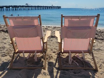 Beach cabana rental with umbrellas and a game package for a beach party.