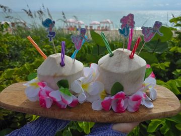 Beach cabana and chair rental near me with umbrellas in West Palm Beach. Fresh coconuts drinks