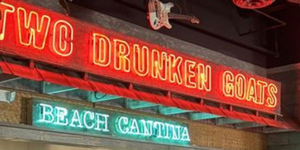 Luxury cabana rental with chairs and umbrellas on Singer Island Beach. Two Drunken Goats