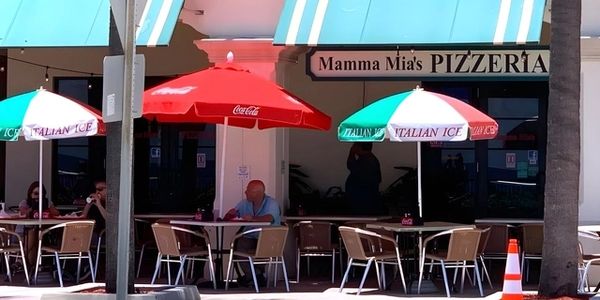 Beach cabana and chair rental at Lake Worth for a sunny beach day. Lake Worth Pier beach chair