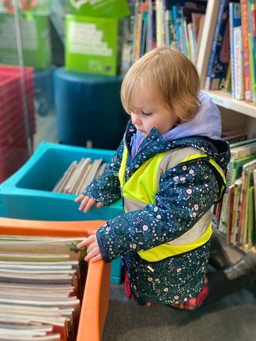 Searching for books in the local library, many regular visits are made here with all the children.