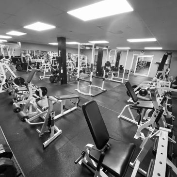 Strength room with rows of weight machines