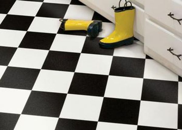 Residential black and white checkered floor with yellow boot.