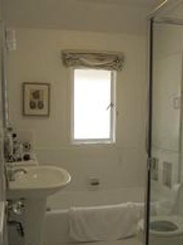 Bathroom with tub and shower combo.
