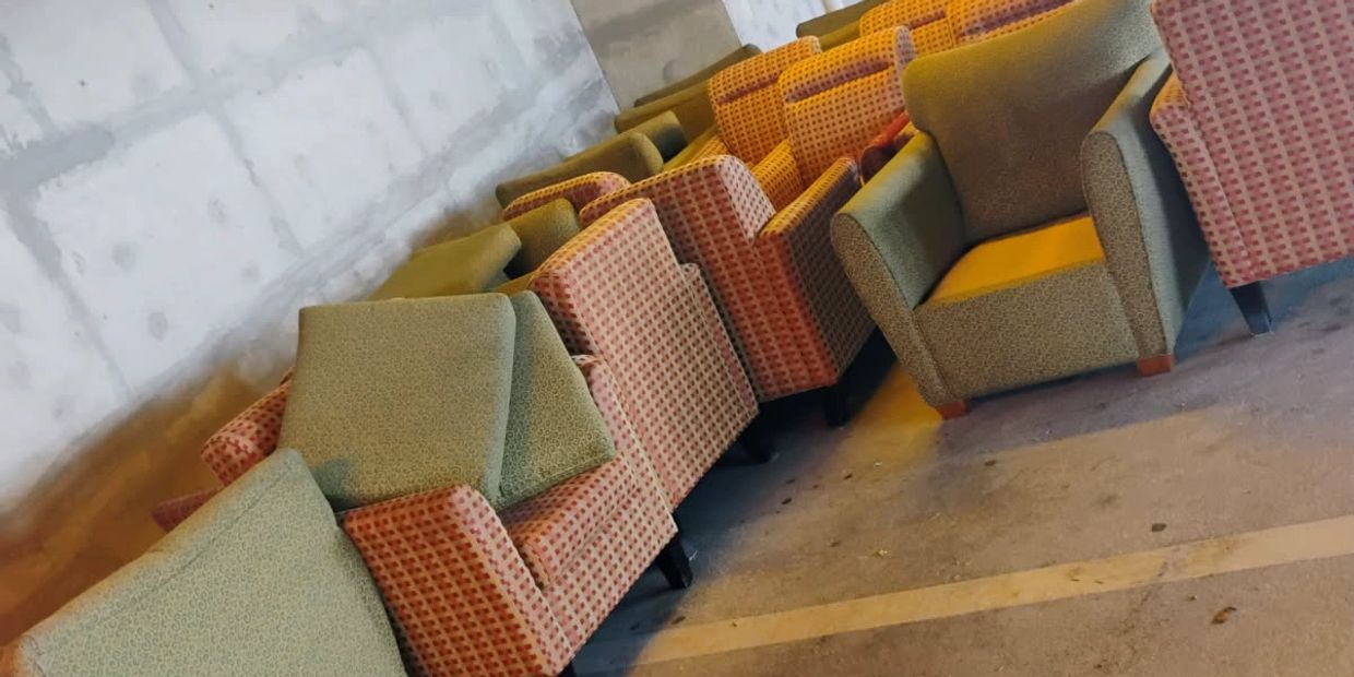 Chairs being remove from hotel by Move It Junk Removal