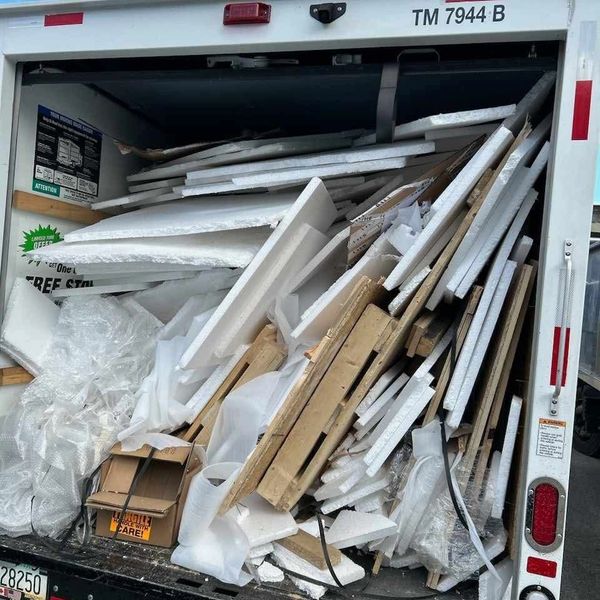 Construction debris in the back of truck to be removed.