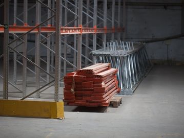 Dismantled and organized warehouse racking
