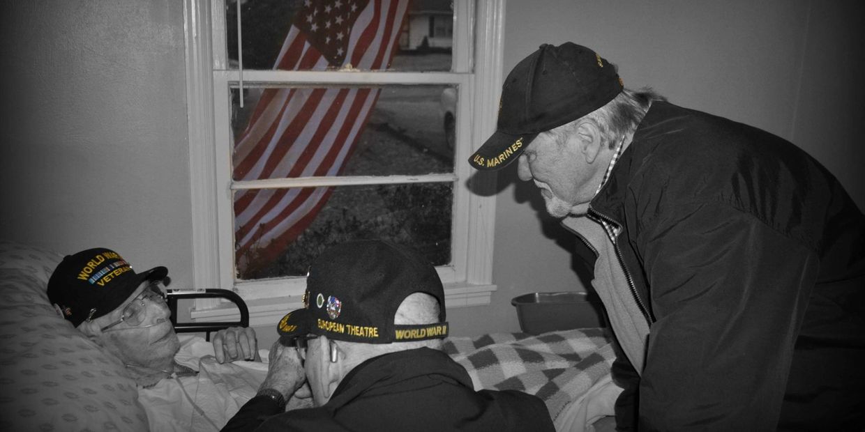 Vietnam and WWII veteran at the bedside of dying WWII veteran.