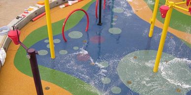 Rubber playground surface. Hotels. Apartment complex. School. Splash Pad.
