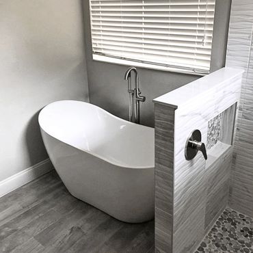Renovated bathroom with special shaped tub and fixtures