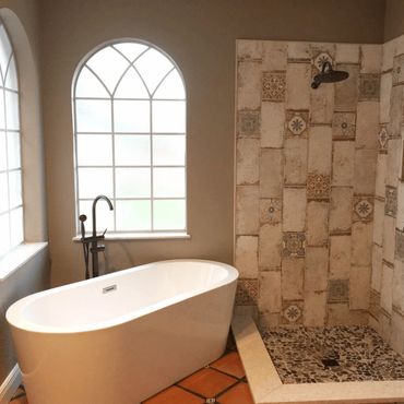 Renovated bathroom with shower and tile work and new tub