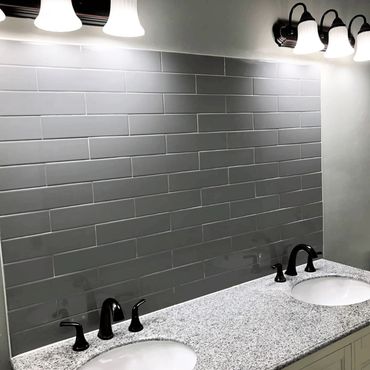 Remodeled bathroom with new backsplash, vanity and fixtures