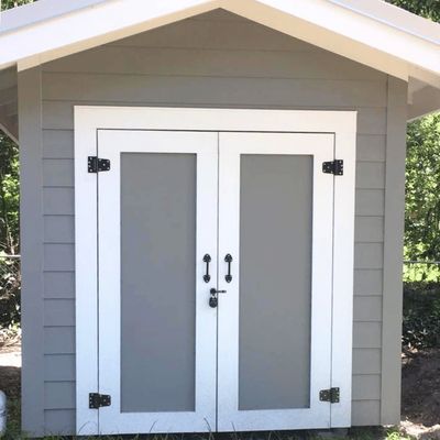 Shed painted gray with white trim