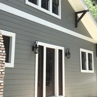 House painted gray with white trim