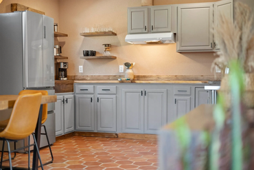 Airbnb photography of a warm desert-style vacation rental kitchen in Joshua Tree, California