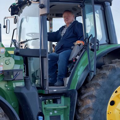 Llew Jones in his tractor on the family farm