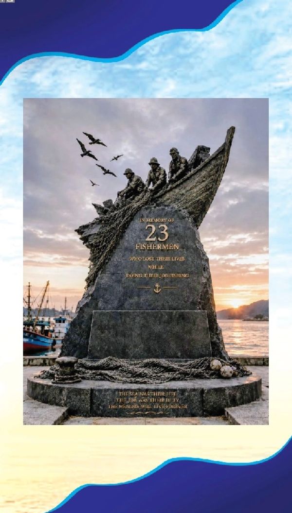 Memorial statue honoring 23 fishermen who died while fishing, set against a sunset by the sea.